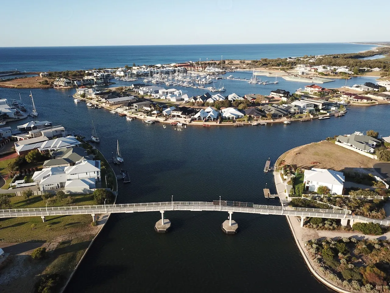 Aerial view of a bridge over the Port Geographe canals