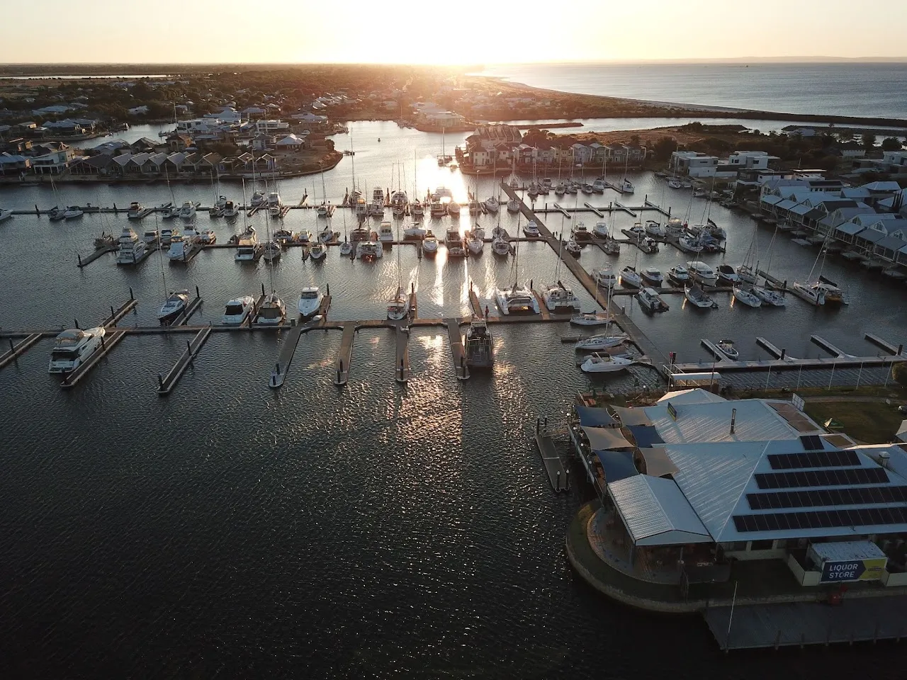 Boats moored in the Port Geographe marina at sunrise