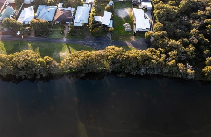 Aerial view of homes beside the Wonnerup estuary